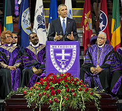 The casket of Rev. Clementa Pinckney sits beneath the podium as President Barack Obama speaks during services honoring the life of  Pinckney, Friday, June 26, 2015, at the College of Charleston TD Arena in Charleston, S.C. Pinckney was one of the nine people killed in the shooting at Emanuel AME Church last week in Charleston.as President Barack Obama delivers the eulogy at his funeral, Friday, June 26, 2015, in Charleston, S.C. (AP Photo/David Goldman)