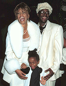 Happier days, young Bobbi Kristina  with parents Whitney Houston and Bobby Brown. (Photo Shutterstock)