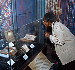 A visitor looks at the artifacts from the Museum of the Bible. (Photo by Bill Z. Foster)
