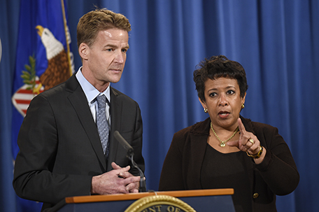 Attorney General Loretta Lynch, right, and U.S. Attorney in Chicago Zachary Fardon, left, speaks during a conference at the Justice Department in Washington, Monday, Dec. 7, 2015, about an investigation into the patterns and practices of the Chicago Police Department after recent protests over a video showing a white Chicago police officer shooting a black teenager 16 times. (AP Photo/Susan Walsh)