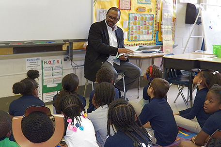 Sheriff Williams reads to the Hartranft third grade class.