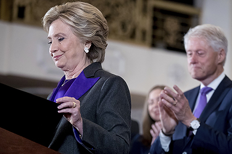 Democratic presidential candidate Hillary Clinton, left, accompanied by her husband former President Bill Clinton, right, finishes speaking at the New Yorker Hotel in New York, Wednesday, Nov. 9, 2016, where she conceded her defeat to Republican Donald Trump after the hard-fought presidential election. (AP Photo/Andrew Harnik)