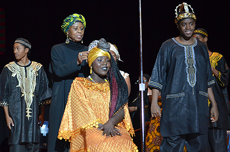 Sister Faatimah Gamble placing royal crown on the winner, Royal Queen Shaquanna Monroe, 17, a senior at Universal Audenried Charter High School. Also, in photo is of winner, Royal King Albert Stephon, 17, senior at Universal Audenried Charter High School. (Photo by Bob Lott)